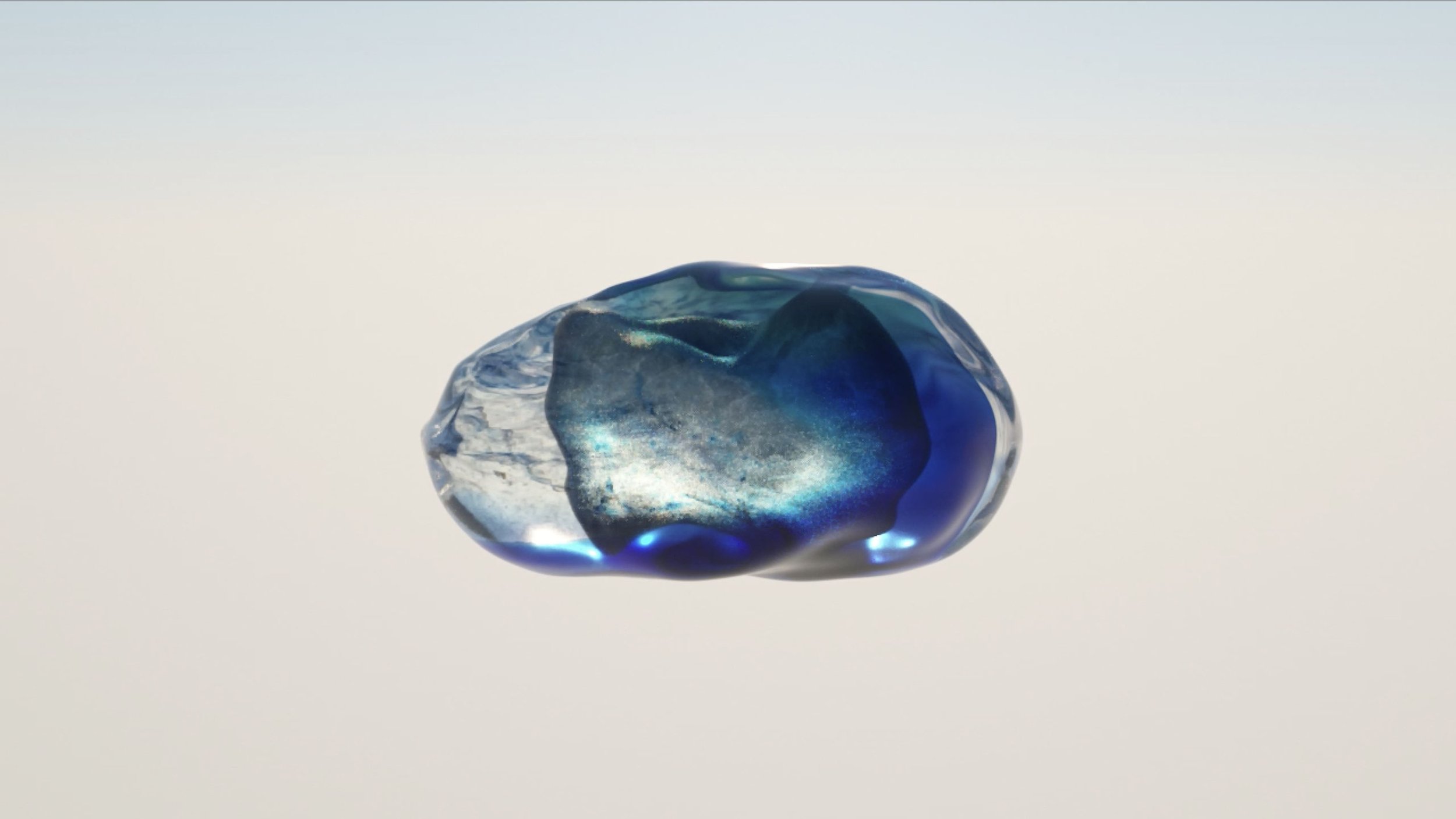 Translucent organic form containing an iridescent blue-green shape suspended against a pale background.